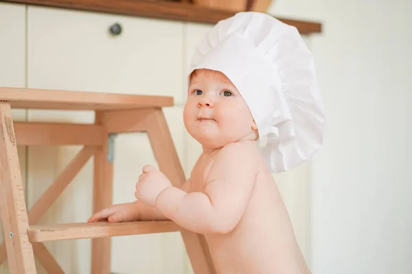 Little baby boy baker enjoying playing on the kitchen close up — Φωτογραφία Αρχείου