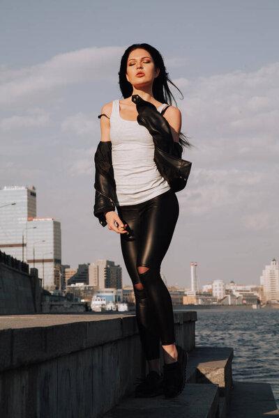 attractive fitness woman lifestyle portrait. caucasian model walking in the city