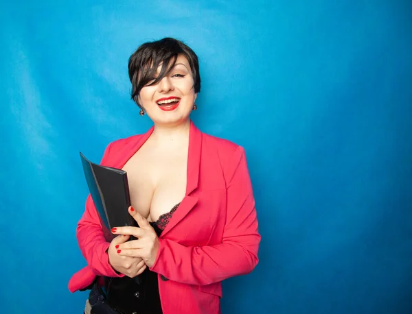 Sexy Secretary in lingerie and bright pink business jacket holding a folder with documents on a blue background in the Studio — Stock Photo, Image