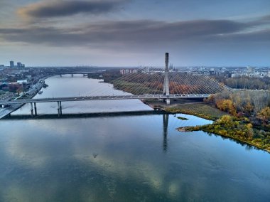 Beautiful panoramic aerial dron view to Swietokrzyski Bridge (Polish: most Swietokrzyski, English: Holy Cross Bridge) - is a bridge over the Vistula river in Warsaw, Poland, from dron DJI Mavic Air clipart