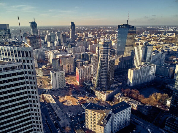 Beautiful panoramic aerial skyline drone view to the skyscrapers located center of Warsaw City, Poland