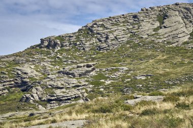 Beautiful panoramic summer steppe landscape of stone mountains 