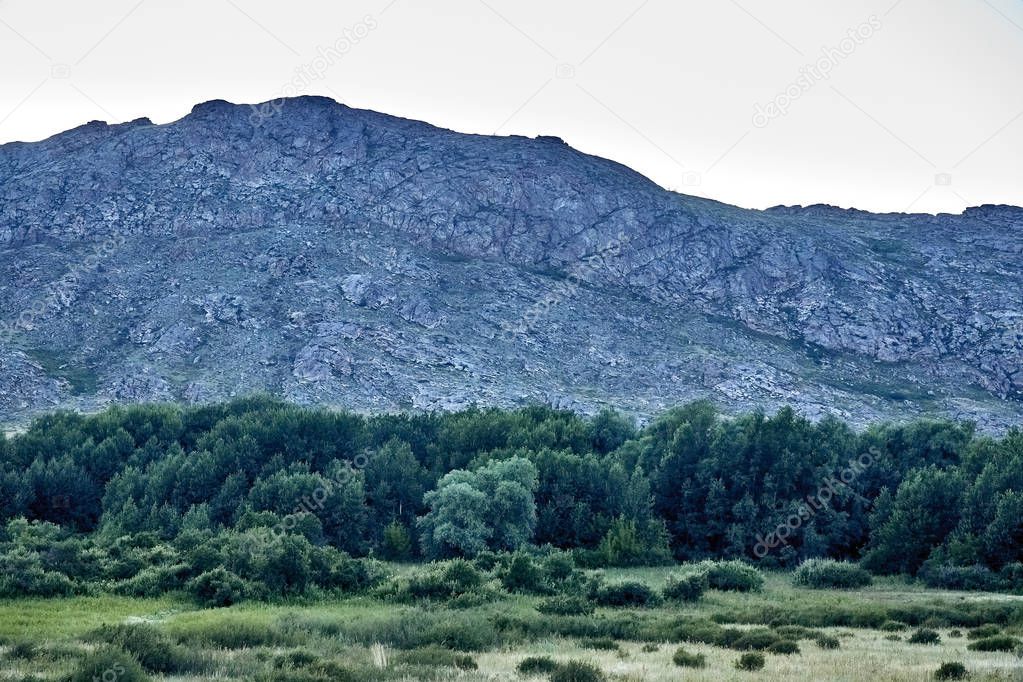 Beautiful landscape of steppe and stone mountains along the road from the city of Ust-Kamenogorsk to the Sibiny lakes (RU: Sibinskiye Ozora: Sadyrkol, Tortkara, Shalkar, Korzhynkol), East Kazakhstan