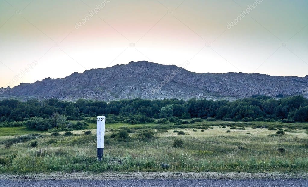 Beautiful landscape of steppe and stone mountains along the road from the city of Ust-Kamenogorsk to the Sibiny lakes (RU: Sibinskiye Ozora: Sadyrkol, Tortkara, Shalkar, Korzhynkol), East Kazakhstan