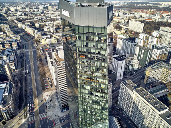 Beautiful panoramic aerial drone view to panorama of Warsaw modern City, Q22 - neomodern office skyscraper designed by APA Kurylowicz & Associates with collaboration from Buro Happold Polska