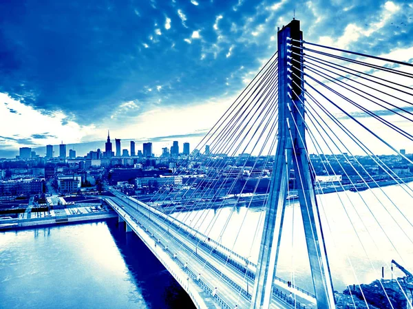 Beautiful panoramic aerial drone sunset view to Warsaw city center with skyscrapers and Swietokrzyski Bridge (En: Holy Cross Bridge) - is a cable-stayed bridge over the Vistula river in Warsaw, Poland — Stock Photo, Image