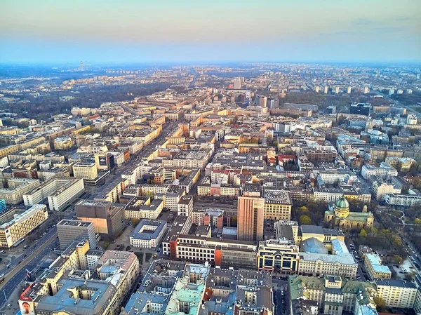 WARSAW, POLAND - APRIL 07, 2019: Beautiful panoramic aerial drone view to the center of Warsaw City in the sunset time in spring — Stock Photo, Image