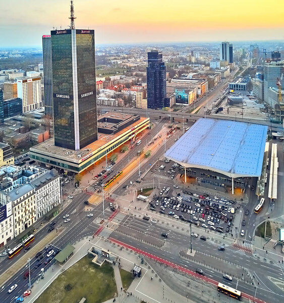 WARSAW, POLAND - APRIL 07, 2019: Beautiful panoramic aerial drone view to the center of Warsaw City in the sunset time in spring