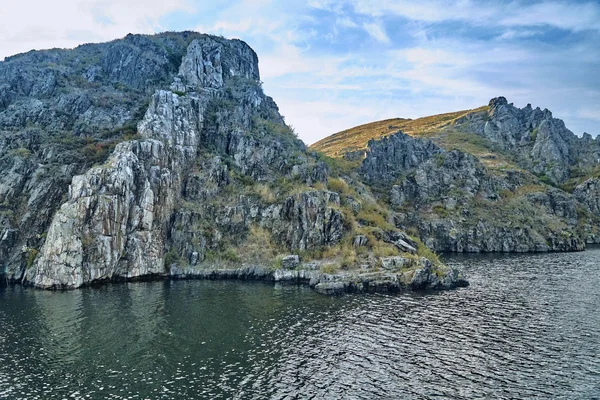 Big old sheer cliffs - summer view to the Bukhtarma artificial reservoir, formed by the dam of the Bukhtarma hydroelectric station on the Irtysh river, East Kazakhstan