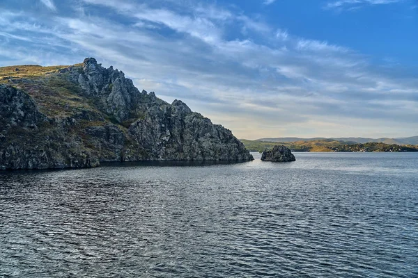 Big old sheer cliffs - summer view to the Bukhtarma artificial reservoir, formed by the dam of the Bukhtarma hydroelectric station on the Irtysh river, East Kazakhstan