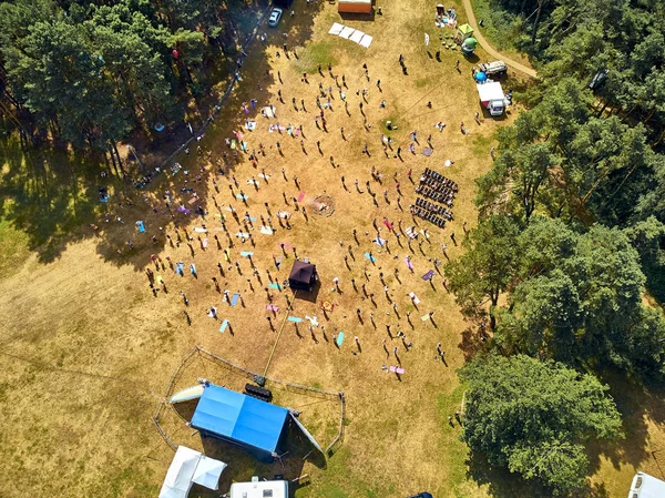 BIALOBRZEGI, POLAND - JULY 13-15, 2019: Beautiful panoramic aerial drone view on people having fun during concert on the Wibracje 3.0 Festival Poland - one of the biggest open air festivals in Poland — Stock Photo, Image