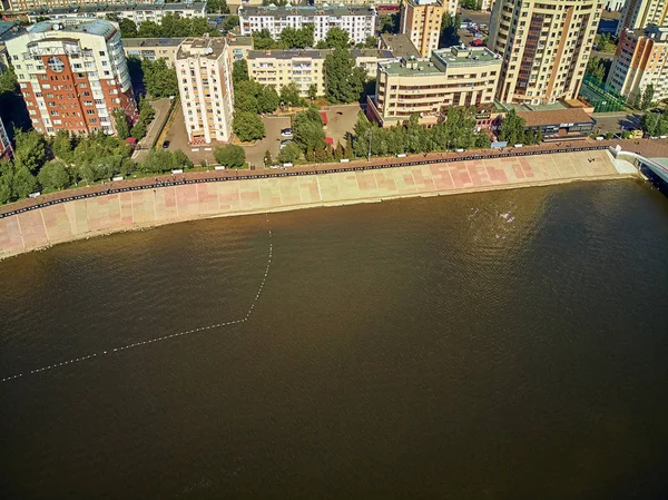 NUR-SULTAN, KAZAKHSTAN - July 30: Beautiful panoramic aerial drone view to Ishim River Embankment ??? Nur-Sultan or Nursultan (Astana) city center with skyscrapers and modern pedestrian bridge — Stockfoto