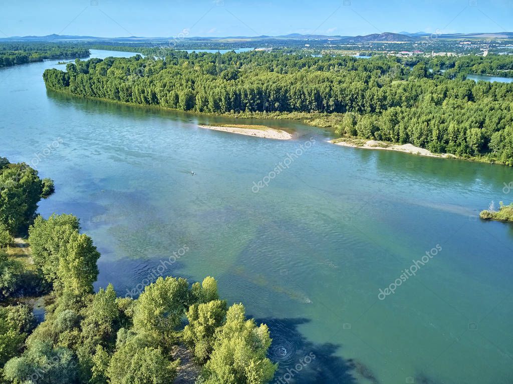 UST-KAMENOGORSK, KAZAKHSTAN - August 09: Beautiful panoramic aerial drone view to the confluence of the rivers Irtysh and Ulba in UST-KAMENOGORSK (Oskemen), QAZAQSTAN