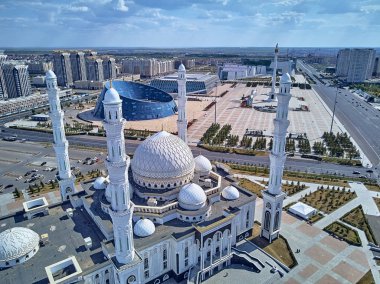 NUR-SULTAN, KAZAKHSTAN - August 11: Beautiful panoramic aerial drone view to Nursultan (Astana) city center with skyscrapers and Hazrat Sultan Mosque clipart