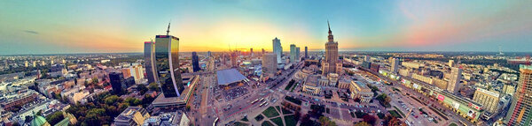 Beautiful panoramic aerial drone view at sunset to the center of Warsaw City and Palace of Culture and Science - a notable high-rise building in Warsaw, Poland
