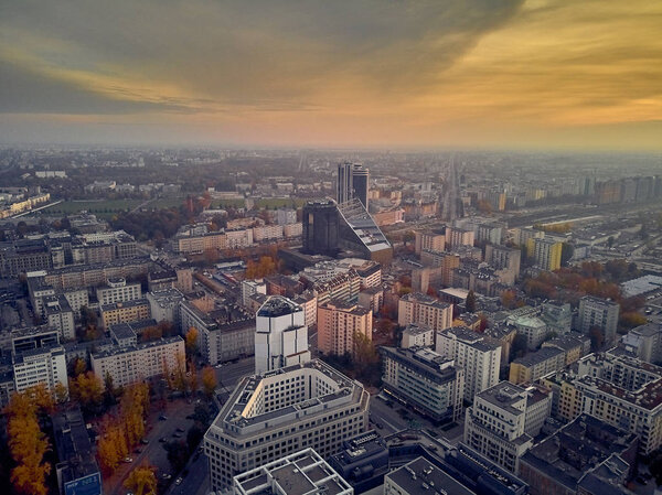 Beautiful panoramic aerial view - look down from above - to the tower of Palace of Culture and Science (PL: PKiN - Palac Kultury i nauki) and cityscape of Warsaw modern City, Poland