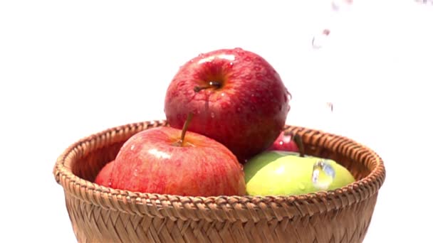 Pouring Water Red Green Apples Bamboo Basket White Background Slow — Stock Video