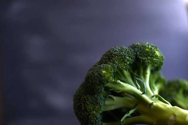 Fresh brocoli on a black matte background