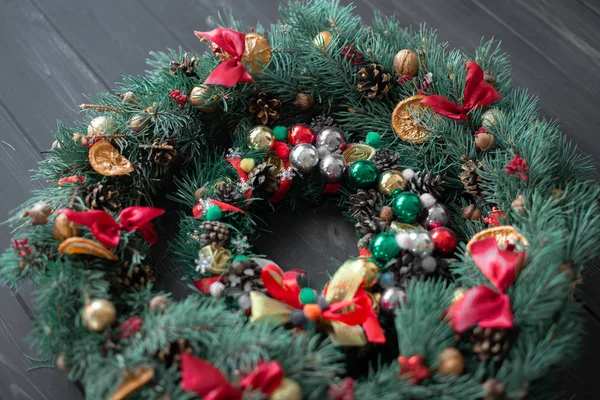 Natural Christmas wreath on black wooden background