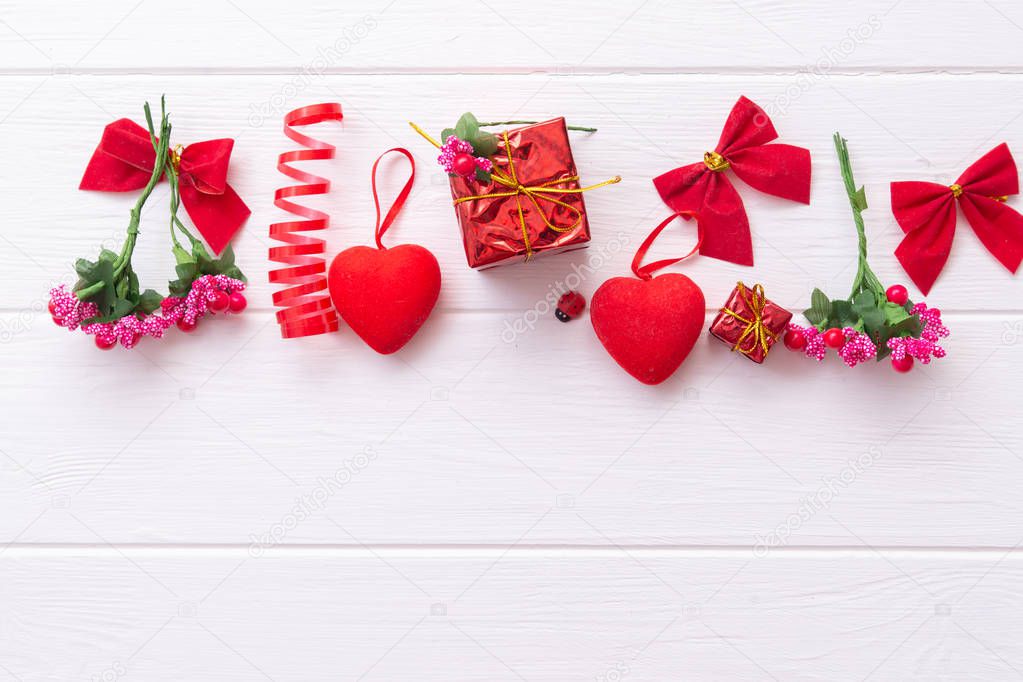 Conceptual still life for Valentine's Day on a wooden white background with space for text