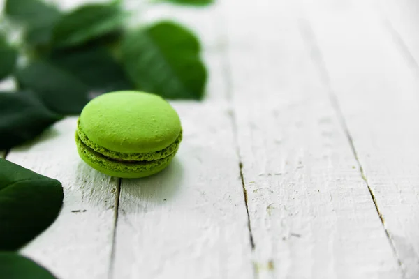 Green macaroon food photo with green leaves
