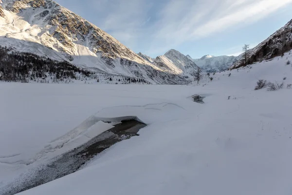 picturesque view of cold mountain river at winter sunny day