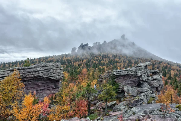 Autumn in the forest and rocks. outdoor recreation in the fall