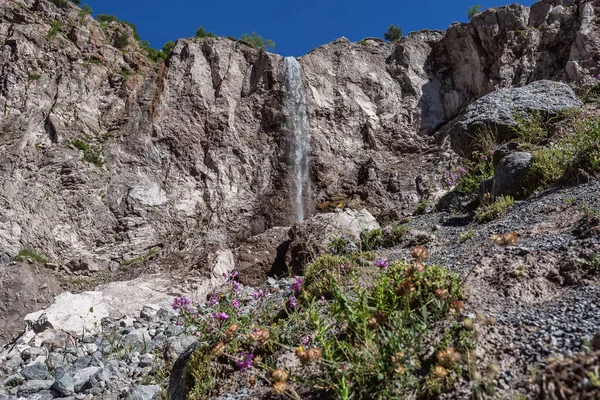 Waterfall in the mountains, high waterfall on the rocks, elbrus. Azau.