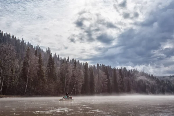 Morning mist on the river. The Ural taiga and the river. A catam