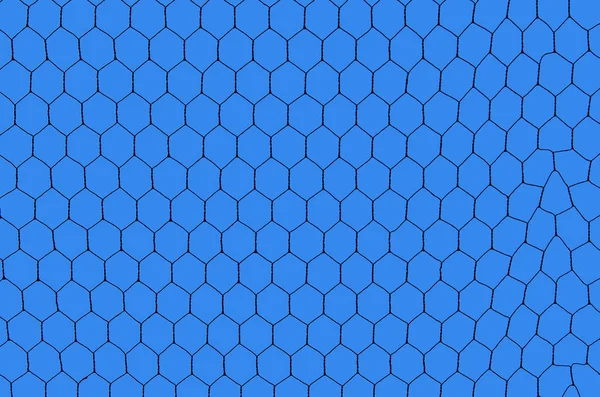 silhouetted iron net against deep blue sky