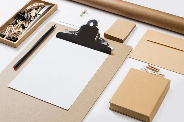 Folder, paper box and other office supplies on a desk