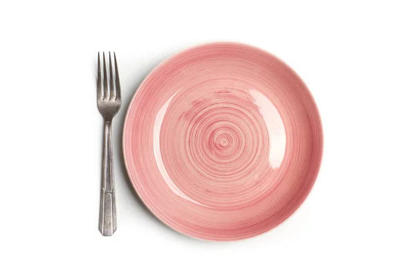 İzole bir görünümde pembe bir tabak ve çatal