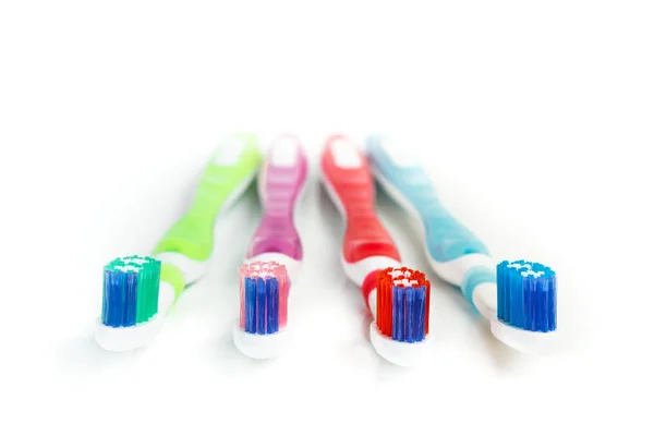 Four Plastic Colored Toothbrushes White Background — Stock Photo, Image