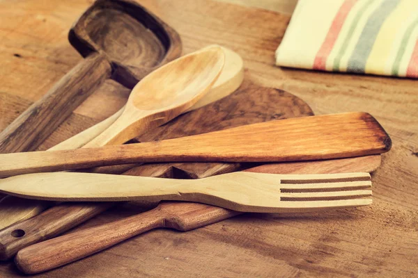 Wood kitchenware on a wooden table
