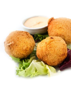 Croquettes with mayonnaise in a bowl