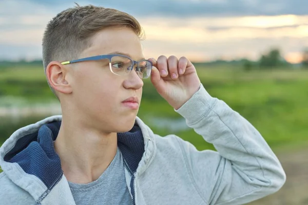 Close-up outdoor portrait of boy of 14 years old with glasses — Stock Photo, Image