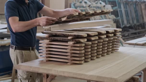 Carpenter folding wooden fence. Showing ok sign with hand gesture — Stock Video