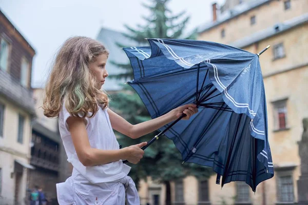 Rainy weather, portrait of beautiful little girl with an umbrella — Stock Photo, Image