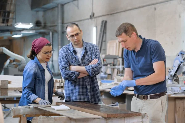 Group of people working in carpentry workshop — Stock Photo, Image