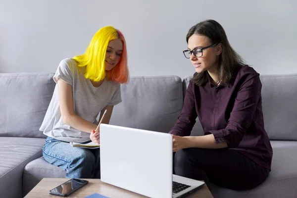 Female teacher teaches individually college student