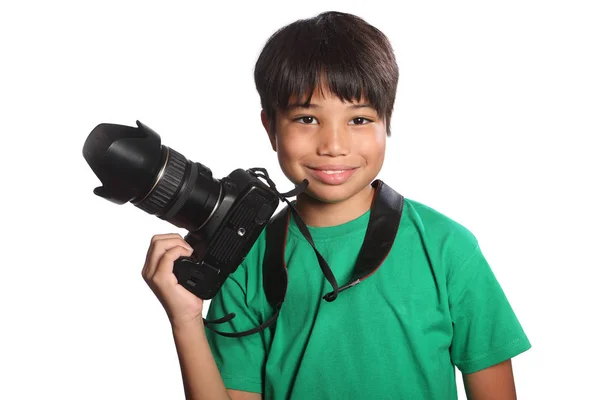 Sonriente escolar niño fotógrafo con cámara réflex digital Fotos De Stock