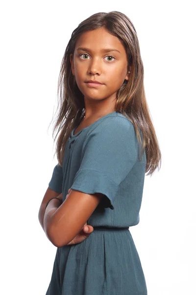 Mixed race girl green eyes with arms folded Stock Picture