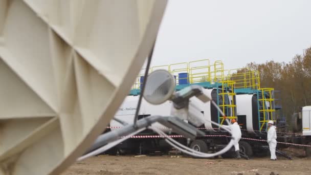 Gas Company Worker White Outfit Climbs Oil Reservoir Truck Platform — Stock Video