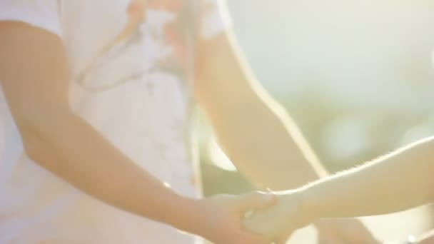 Closeup Happy Enamored Couple White Clothes Walks Street Joining Hands — Stock Video