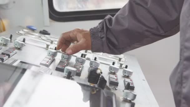 Closeup Side View Employee Grey Uniform Turns Levers Extracting Equipment — Stock Video