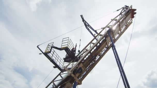 Courageous Employee Works on Geodetic Machine Top — Stock Video