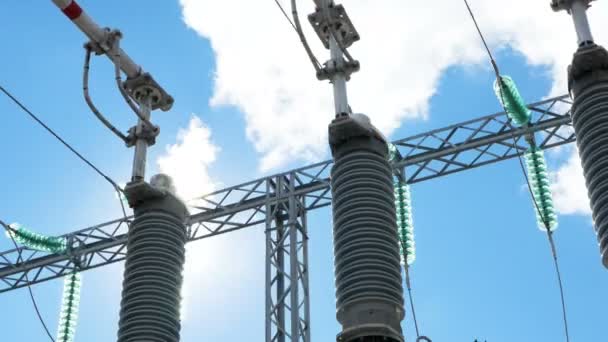 Modern transformer with glass insulators against blue sky — Stock Video