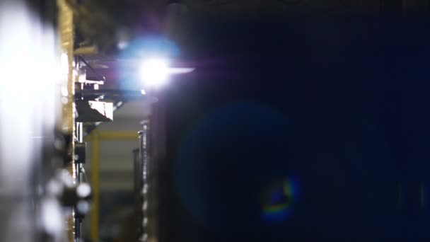 Camera shows metal tanks cleaned with water on conveyor — Stock Video