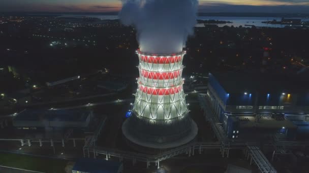 Aerial panorama cooling tower with rising steam against city — Stock Video