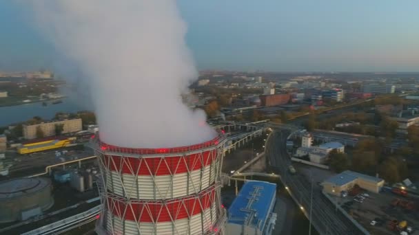 Motion above cooling tower with steam at heating station — Stock Video